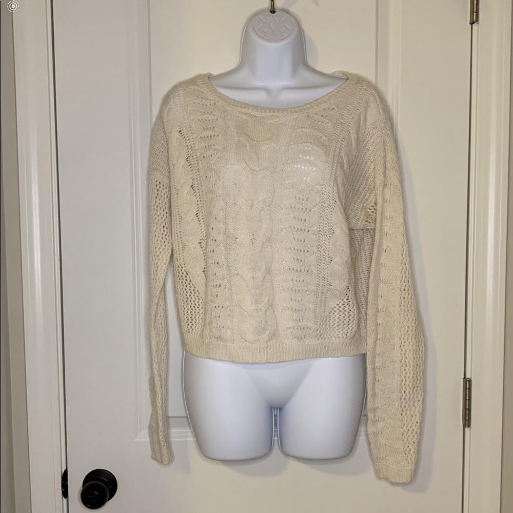 Off white colored sweater.